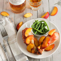 picture of whiskey peach chicken recipe with chicken drumsticks when finished cooking