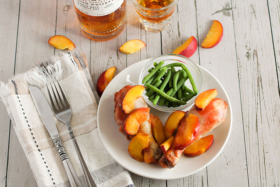 picture of whiskey peach chicken recipe with chicken drumsticks when finished cooking