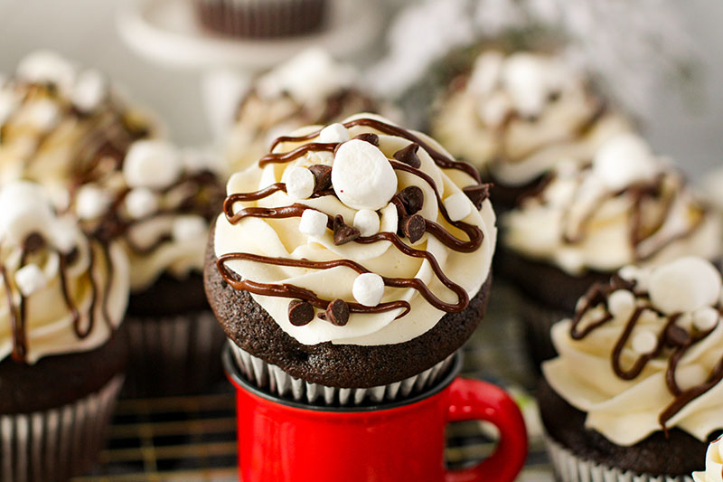 picture of a grouping of hot cocoa cupcakes on a table