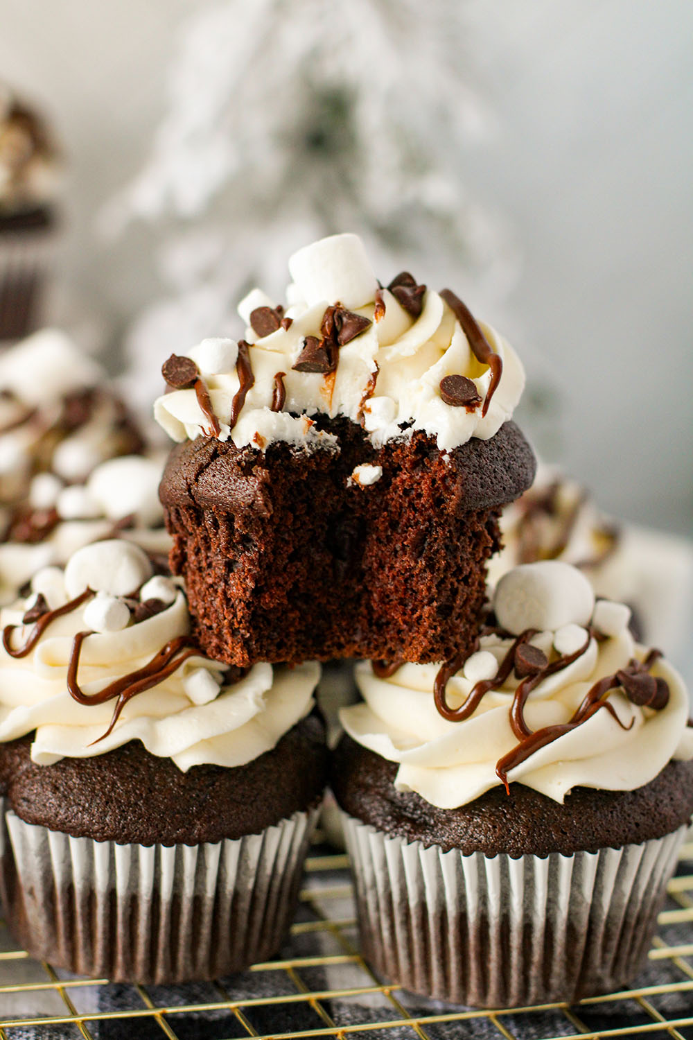 picture of a grouping of hot cocoa cupcakes on a table