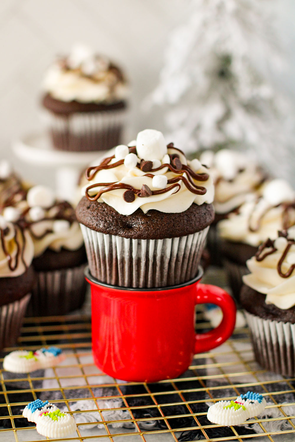 picture of a grouping of hot cocoa cupcakes on a table