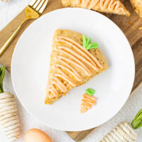 picture of carrot cake scones with icing on a plate