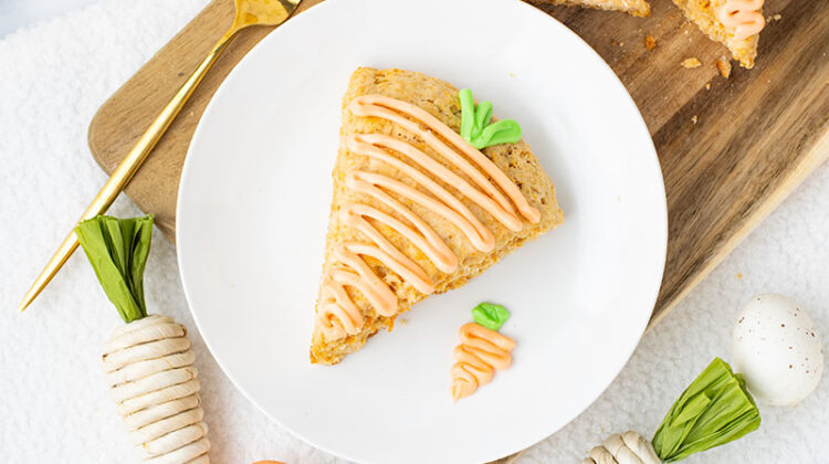 picture of carrot cake scones with icing on a plate