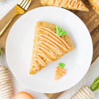 picture of carrot cake scones with icing on a plate