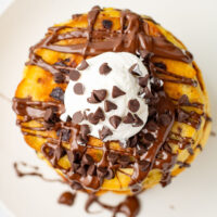 picture of Chocolate Chip Pancakes with delightful chocolate sauce, chips, and fluffy cream