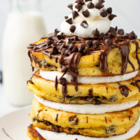 picture of Chocolate Chip Pancakes with delightful chocolate sauce, chips, and fluffy cream