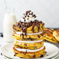 picture of Chocolate Chip Pancakes with delightful chocolate sauce, chips, and fluffy cream