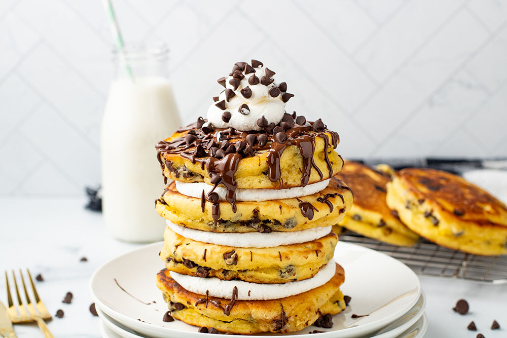 picture of Chocolate Chip Pancakes with delightful chocolate sauce, chips, and fluffy cream