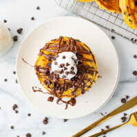 picture of Chocolate Chip Pancakes with delightful chocolate sauce, chips, and fluffy cream